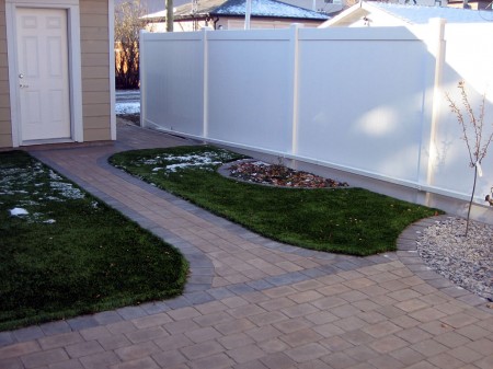 Maintenance-Free Yard with Artificial Turf and Brick Patio
