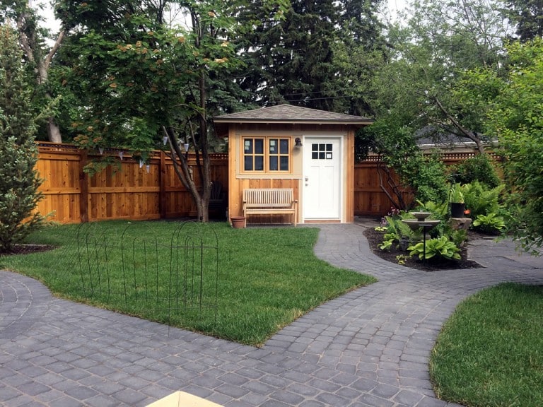 Paving stone patio installation in Calgary backyard